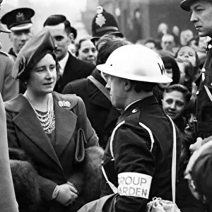 Royal visit to Salford - King George VI & Queen Elizabeth talking to a group warden in