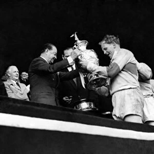 Rugby League Cup Final 1956. St. Helens v. Halifax. Prescott of St. Helens receives cup