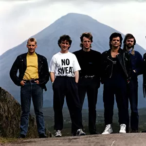 Runrig folk Gaelic celtic rock group standing in front of mountain circa 1990