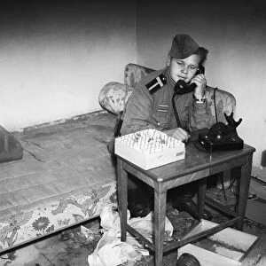 Russian officer making a phone call in the ruins of the Reich Chancellery, Berlin