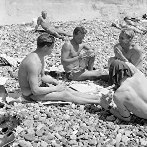 Russin holiday makers seen here playing cards on the beach at Sochi region of Krasnodar