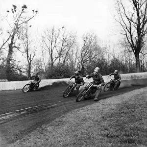 Rye house speedway school. Manager Alan Mitchele with Alan Briggs explains how to corner