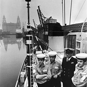 Sailors and Naval officer on board minesweeper HMS Mersey