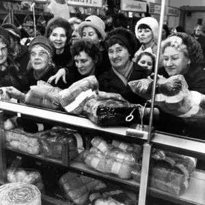 The sales rush is on and eager housewives crowd around the counter in a Liverpool store The sales rush is on and eager housewives crowd around the counter in a Liverpool store