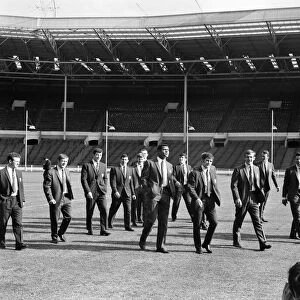 Salford Red Devils rugby league team members inspect the pitch at Wembley Stadium ahead