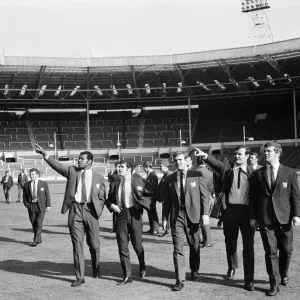 Salford Red Devils rugby league team members inspect the pitch at Wembley Stadium ahead