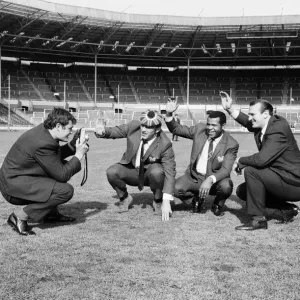 Salford Red Devils rugby league team members inspect the pitch at Wembley Stadium ahead