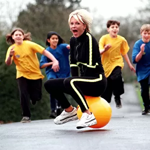 Sally Gray TV Presenter of the new 50 / 50 childrens show on a space hopper - March 1998