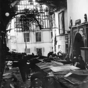Salvage workers shift through the wreckage the Guildhall after a direct hit