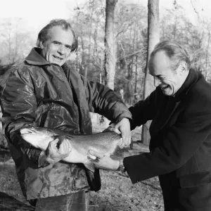 Sam Holland (left), trout farmer with James Pettigrew, hold some of the outsize trout Sam Holland (left), trout farmer with James Pettigrew, hold some of the outsize trout