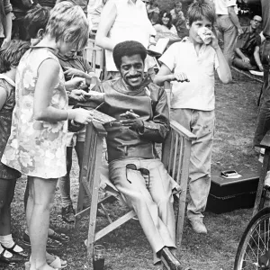 Sammy Davis Junior signing autographs whilst on location of One More Time Sammy Davis Junior signing autographs whilst on location of One More Time