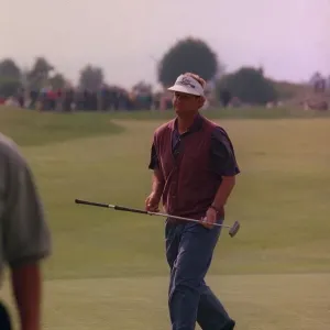 Sandy Lyle golfer on green carrying putter wearing skip cap at Gleneagles golf course Sandy Lyle golfer on green carrying putter wearing skip cap at Gleneagles golf course