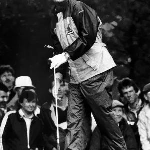Sandy Lyle golfer watching shot from tee holdng golf club Sandy Lyle golfer watching shot from tee holdng golf club
