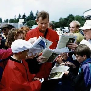 Sandy Lyle signs autographs for his fans at the British Golf Open Sandy Lyle signs autographs for his fans at the British Golf Open