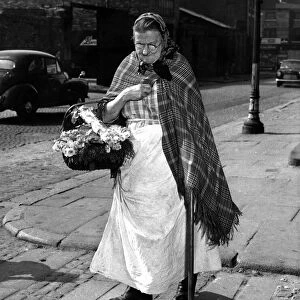 Sarah Burke 78 from Baker Street Liverpool, heads home after a day spend selling flowers