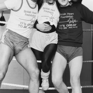 Saturday presenter Sarah Green, helped put John Conteh (left Saturday presenter Sarah Green, helped put John Conteh (left