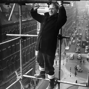 Scaffolder oblivious to working at height, high above central Birmingham Scaffolder oblivious to working at height, high above central Birmingham