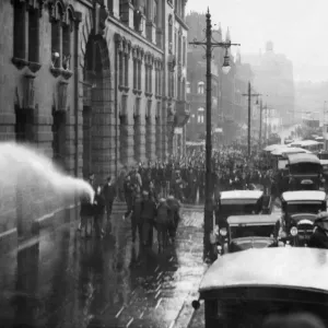 A scene of chaos and confusion as firemen turn the hose on a demonstration of unemployed A scene of chaos and confusion as firemen turn the hose on a demonstration of unemployed