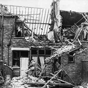 Scene of destruction showing damage to housing at the rear of 134