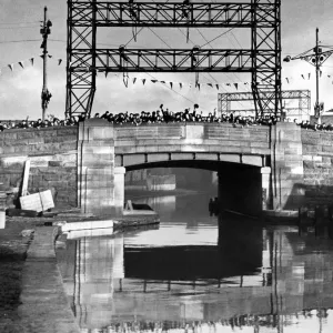 A scene of people on a bridge celebrating the coronation of King George VI A scene of people on a bridge celebrating the coronation of King George VI