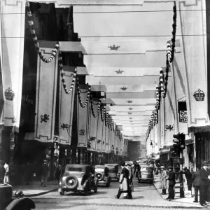 A scene of a street in preparation for celebrations of the coronation of King George VI A scene of a street in preparation for celebrations of the coronation of King George VI