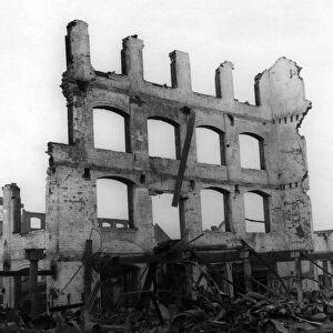 A scene from the suburb of Cheylesmore, Coventry, showing bomb damage to buildings