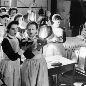 Scene at Westminister Hospital on Christmas Eve - 1940 Nurses walk through wards Scene at Westminister Hospital on Christmas Eve - 1940 Nurses walk through wards