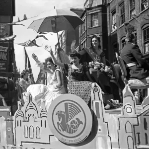 Scenes during the annual Soho Fair in Central London. Miss Soho waving to Scenes during the annual Soho Fair in Central London. Miss Soho waving to
