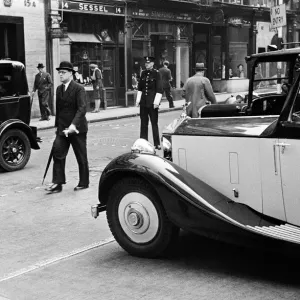 Scenes in Bond Street, Central London with man wearing bowler hat