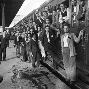 Scenes in Naples, southern Italy showing men arriving at the railway station Scenes in Naples, southern Italy showing men arriving at the railway station