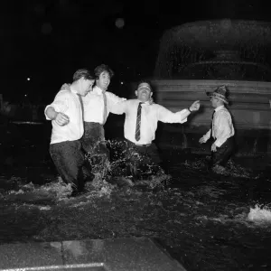 Scenes in Trafalgar Square Fountain as the New Year comes in