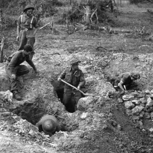 Print of Allied troops in a bomb crater, Northern France, 19th July 1944