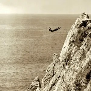 This scenic shot of rocky cliffs and the sea below is the setting for local divers - who This scenic shot of rocky cliffs and the sea below is the setting for local divers - who