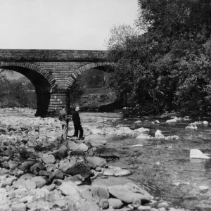 A scenic view near the bridge across the River Tyne at Alston, Cumbria. June 1934