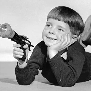 Schoolboy seen here playing with a Dan Dare ray gun 2nd December 1957