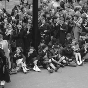 Schoolchildren enjoy a ice lolly on Victoria Embankment whilst waiting for the Royal Schoolchildren enjoy a ice lolly on Victoria Embankment whilst waiting for the Royal