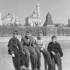 Four schoolchildren pose on the banks of the Moskva River in Moscow Four schoolchildren pose on the banks of the Moskva River in Moscow