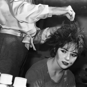 Schoolgirl Laura Goldsmith transforms into a punk rocker. 18th December 1980