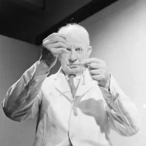 Scientist carrying out an experiment. April 1959