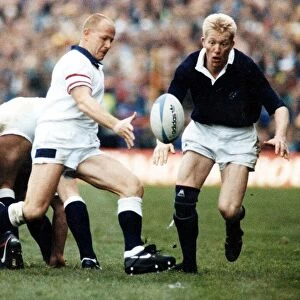 Scotland Rugby player John Jeffrey watches as England scrum half clers the ball from a