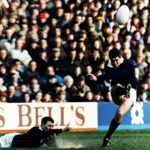 Scotland rugby skipper Gavin Hastings kicking ball in air which was held in place by Scotland rugby skipper Gavin Hastings kicking ball in air which was held in place by