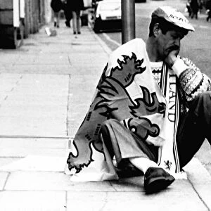 Scots football fan Italia 1990 World Cup dejected Scotland fan sits on pavement