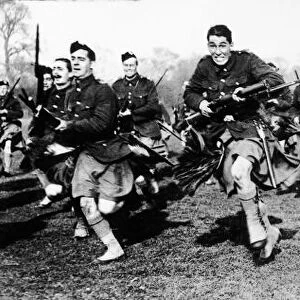 Scottish soldiers practise bayonet charging during World War One