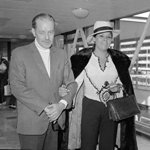 Scottish thriller writer Alistair MacLean with his wife Mary Marcelle Maclean leave