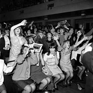 Screaming girl fans greet the Beatles last night on their appearance in Leicester