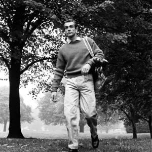 Sean Connery playing golf near new house in Acton. The house was once a Convent