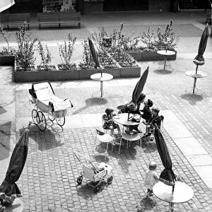 Seating ouside the circular Godiva Cafe in the Lower Precinct