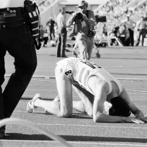 Sebastian Coe collapses to the ground with relief after winning the Mens 1500 metres