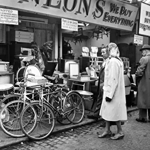 A second-hand stall in Belfast, Northern Ireland. 9th October 1963