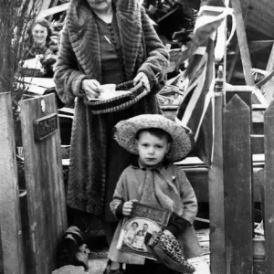 During the second world war, a little boy stands outside the shambles of his bombed home During the second world war, a little boy stands outside the shambles of his bombed home